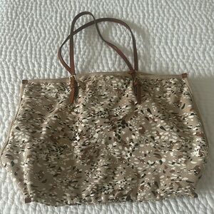 Tan canvas bag with pouch.